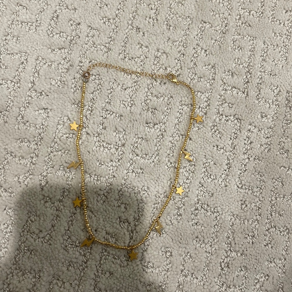 Gold star and lightning bolt necklace
